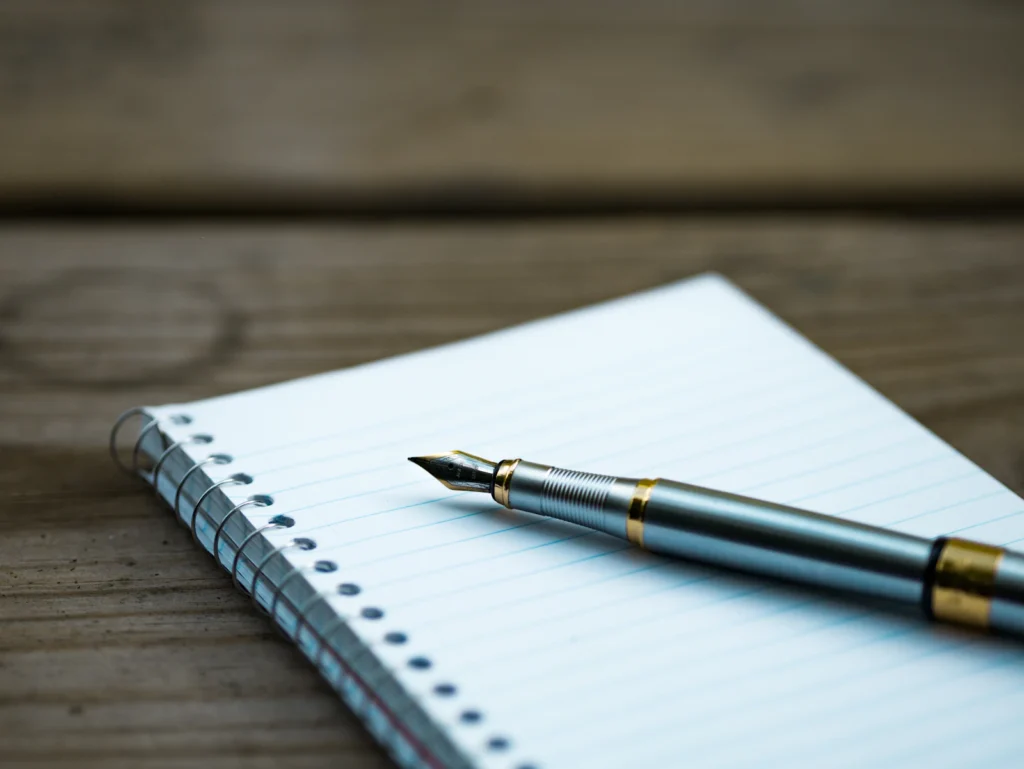 Notebook Pen Writing illustrating iq test sample questions