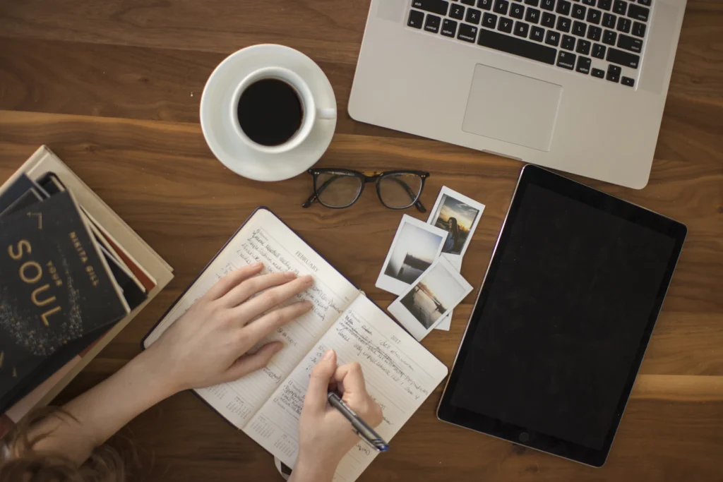 Person Studying Desk illustrating mensa practice test